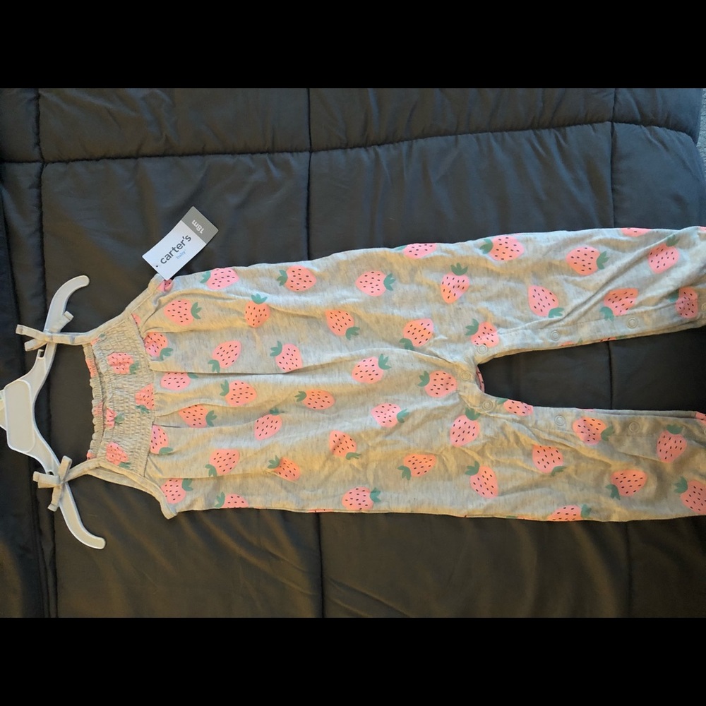 Carter’s. Girls. One piece. Strawberry print. Size 18 months. New with tags.